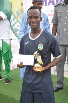Nigerian Navy’s Augustine Chibuzor receives the Most Valuable player of the tournament award. 
