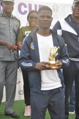 Nigerian Navy’s Ayetoba Iseoluwa receives the Best Goalkeeper of the tournament award.